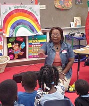 Extension agent teaching nutrition to school children