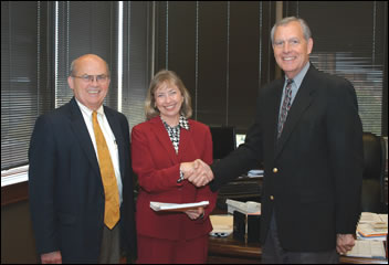 University of Tennessee Interim President Dr. Joe Johnson (at left) and Dr. Jack Britt, vice for agriculture, congratulate Dr. Shirley Hastings, associate dean of Extension, on the $20 million grant to continue the Tennessee Nutrition and Consumer Education Program.